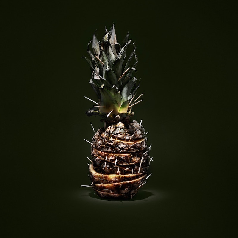 a picture of one pineapple against black background